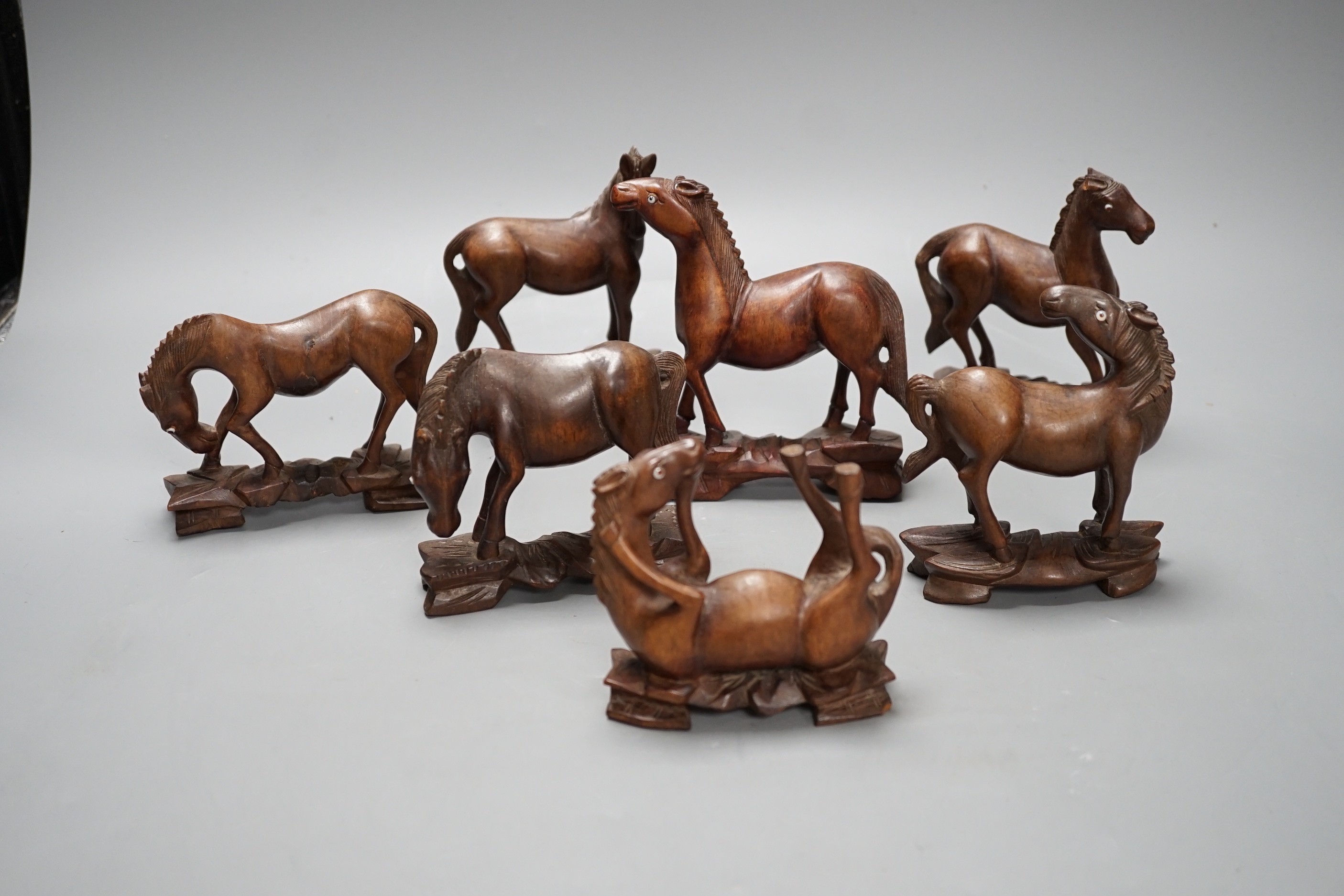 Seven Chinese hardwood models of horses. Tallest 13cm